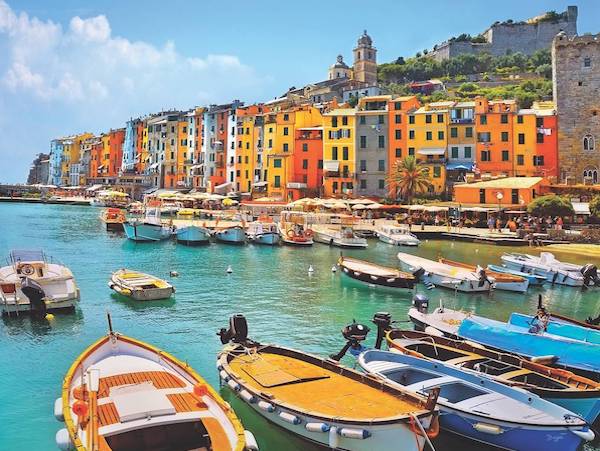 Colourful waterfront houses and boats in Portovenere, Italy